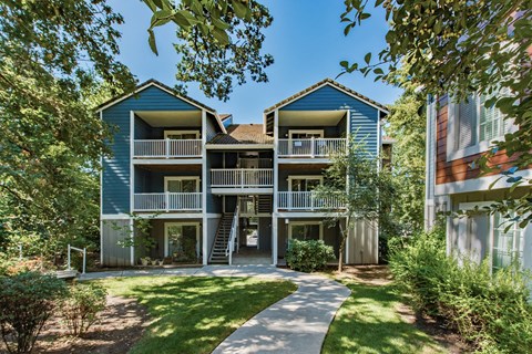 Blue building with a sidewalk in front of it at Canyon Creek, Wilsonville, OR