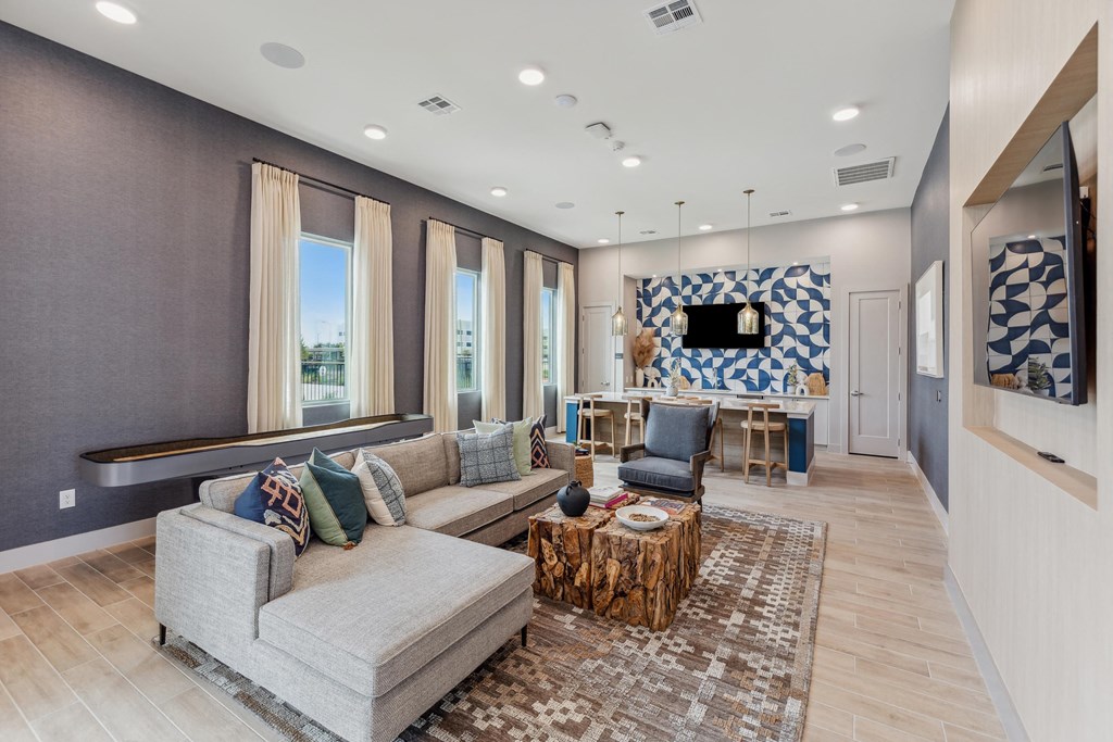 clubroom with seating and a kitchen