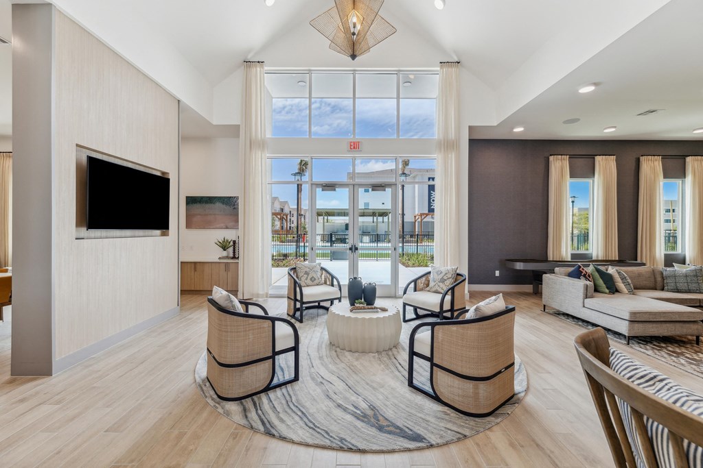 a living room with furniture and a large window
