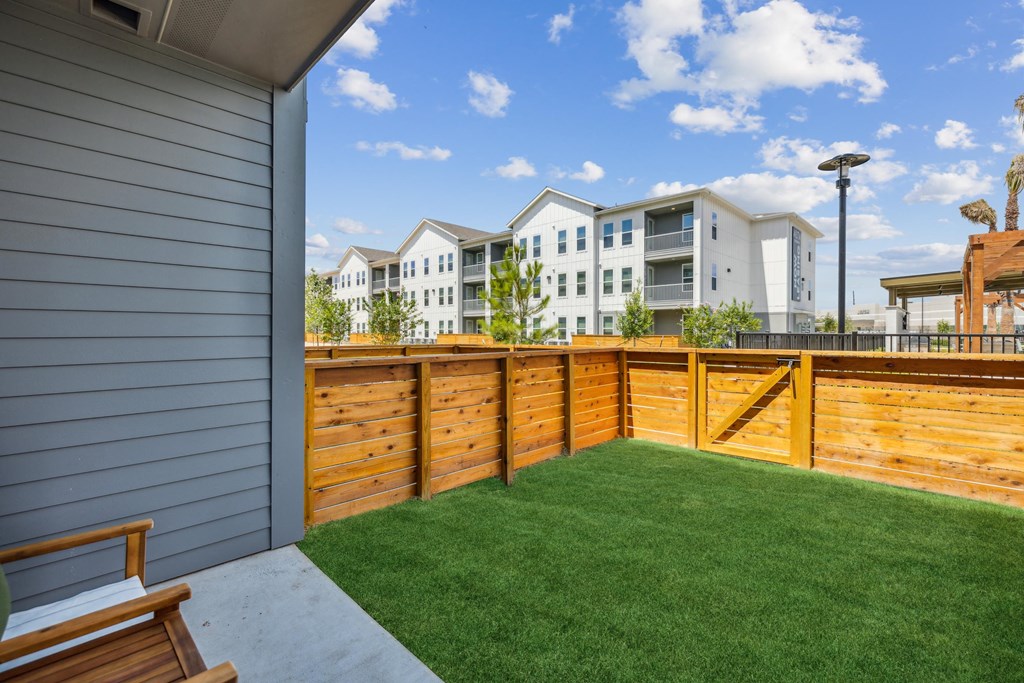 fenced yard attached to apartment home