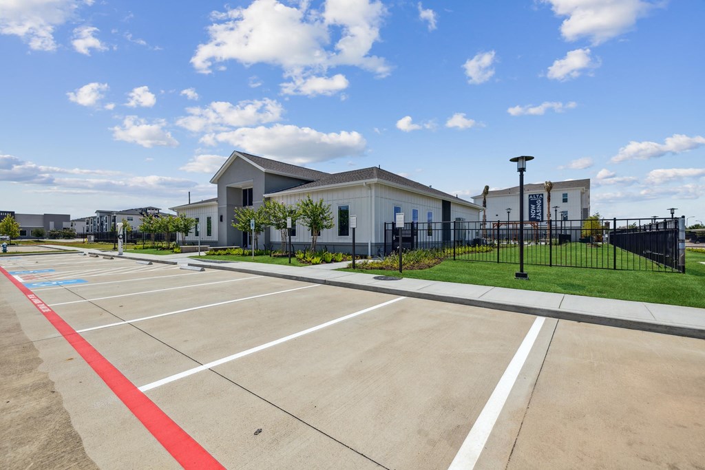 a parking lot with a building in the background