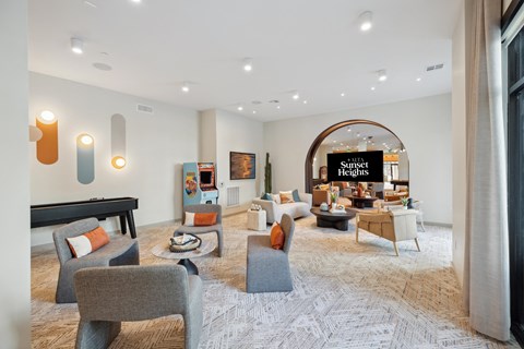 A living room with a pool table and a sign that says "St. Regis Heights".