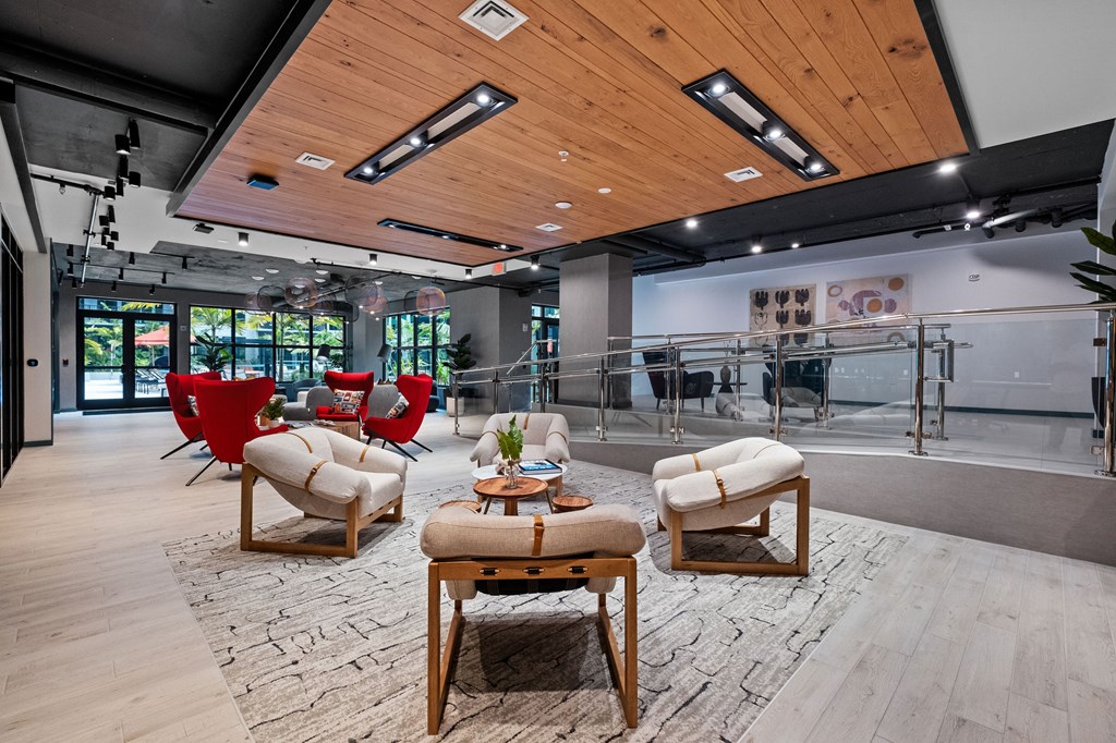 A modern living room with wooden floors and furniture.