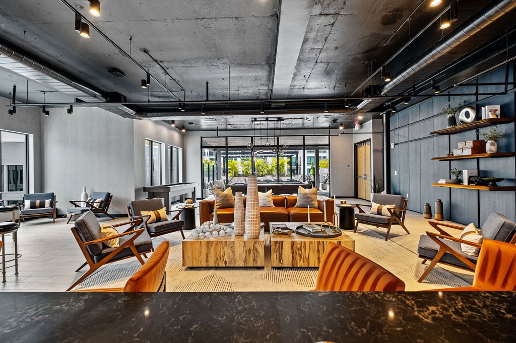 A modern living room with a wooden coffee table in the center.