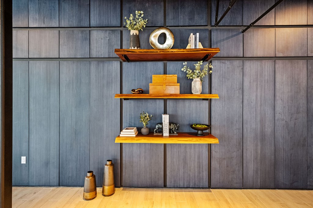 A shelf with various items on it in a room.
