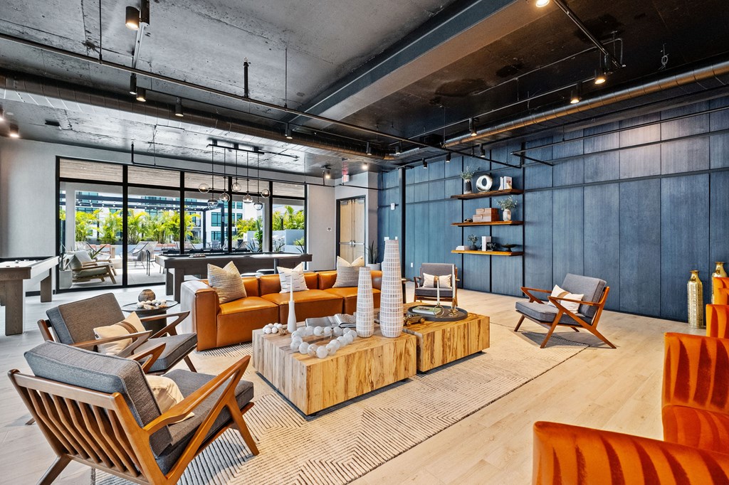 A modern living room with a wooden floor and furniture.