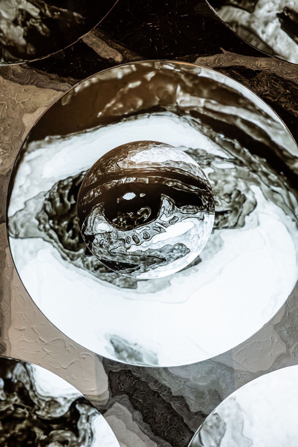 A chocolate eyeball is sitting on a white surface.