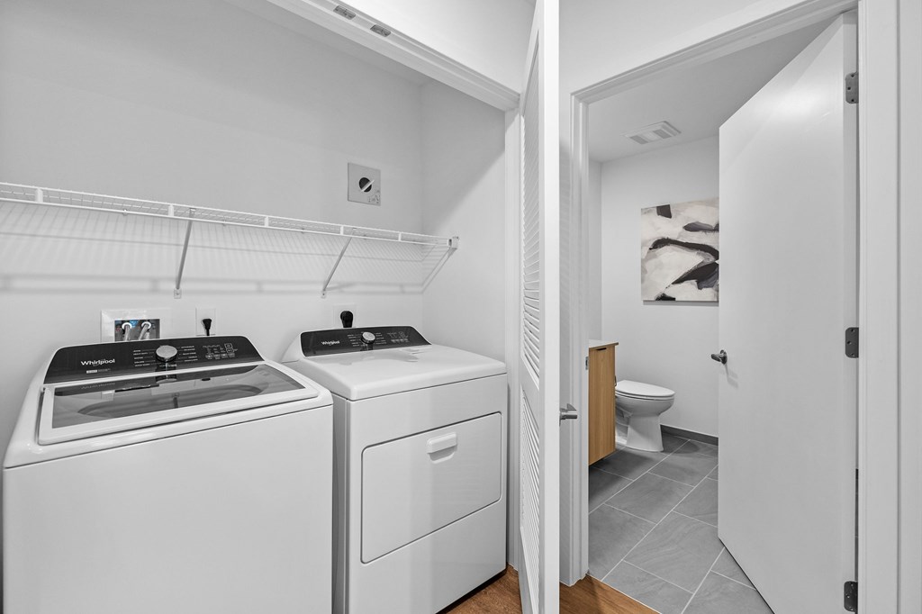 A laundry room with a washer and dryer.