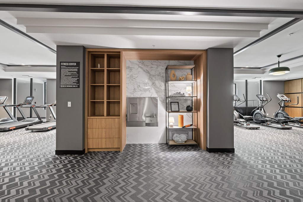 A gym with treadmills and exercise equipment.