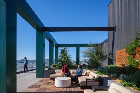 A patio with couches and tables