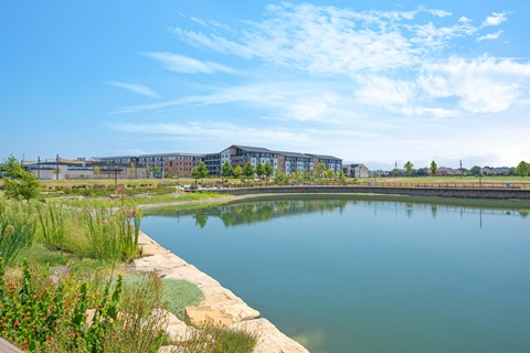 a body of water with buildings in the background
