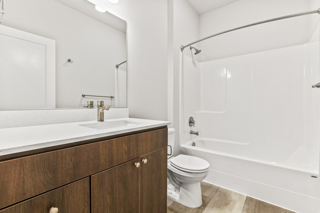 a bathroom with a sink toilet and a shower