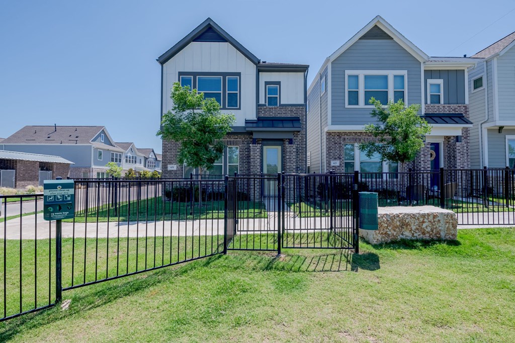 a house with a wrought iron fence in front of it