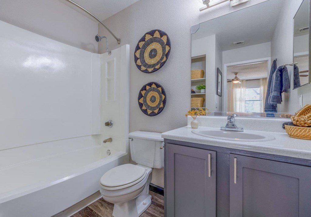 a bathroom with a sink toilet and a bath tub