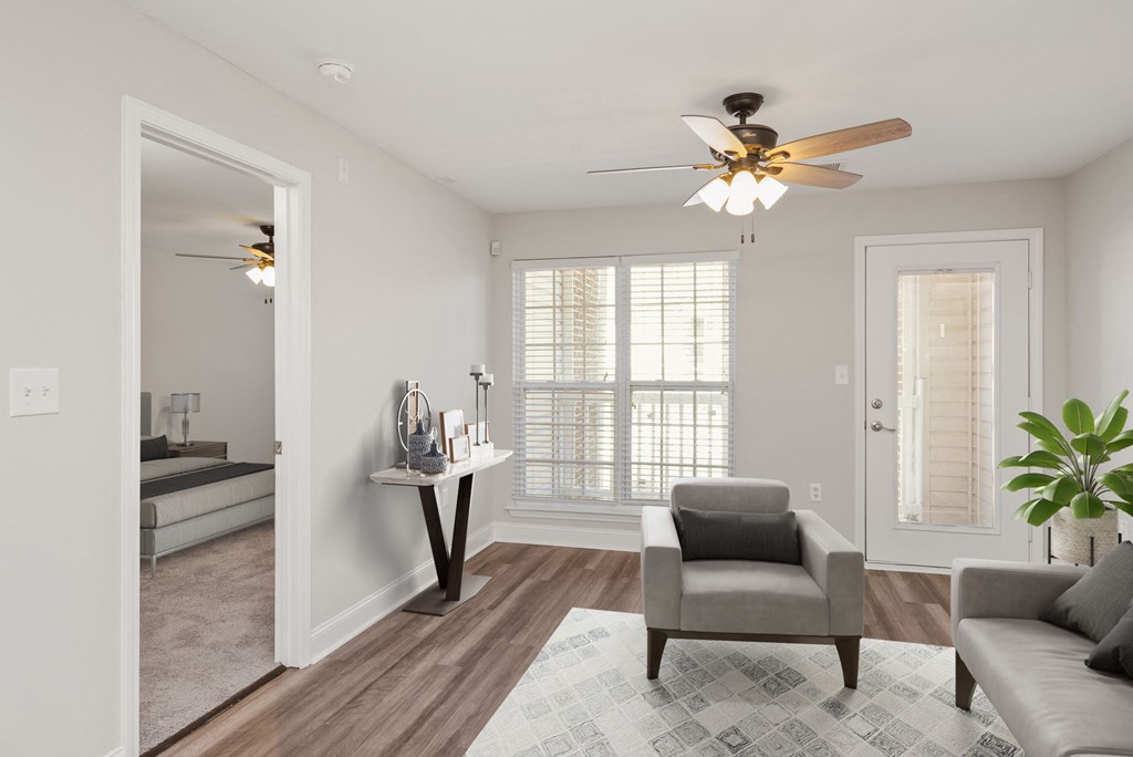 a living room with a ceiling fan
