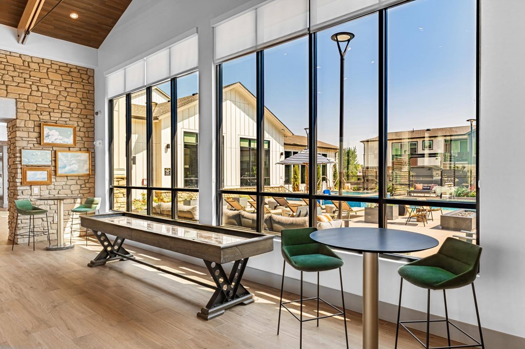 Great room with shuffle board and large windows