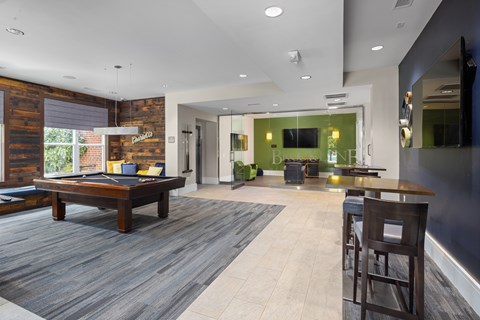 A modern living room with a wooden table and chairs.