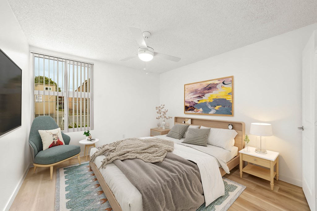 a bedroom with a large bed and a tv