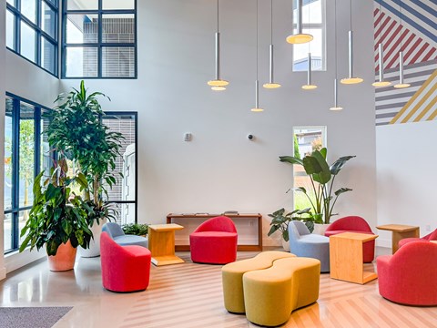 A room with a white wall and a striped pattern on the wall.