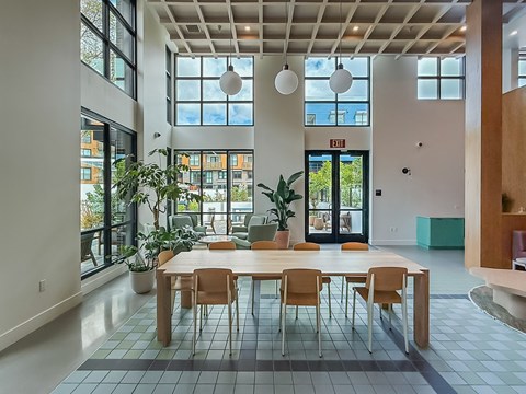 A conference room with a long table and chairs.