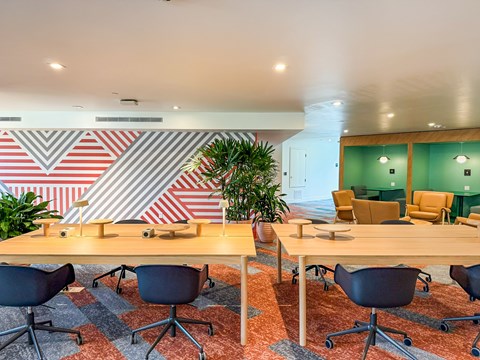 A conference room with a long table and chairs.