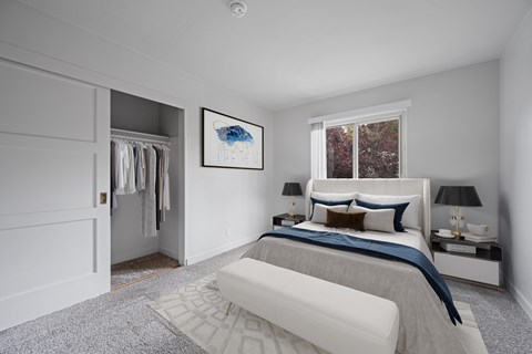 A bedroom with a large bed and a painting on the wall. at Hillsdale Garden, San Mateo, 94403