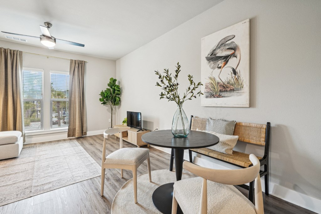 our apartments offer a living room and dining room with a table and chairs