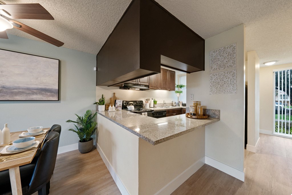 a kitchen and dining area in a 555 waverly unit