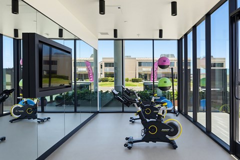 24 hour fitness center with ample work out equipment
