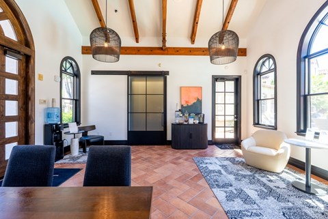 A living room with a wooden table and chairs.