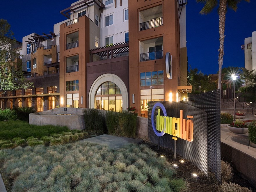 domicilio apartment exterior at night with sign