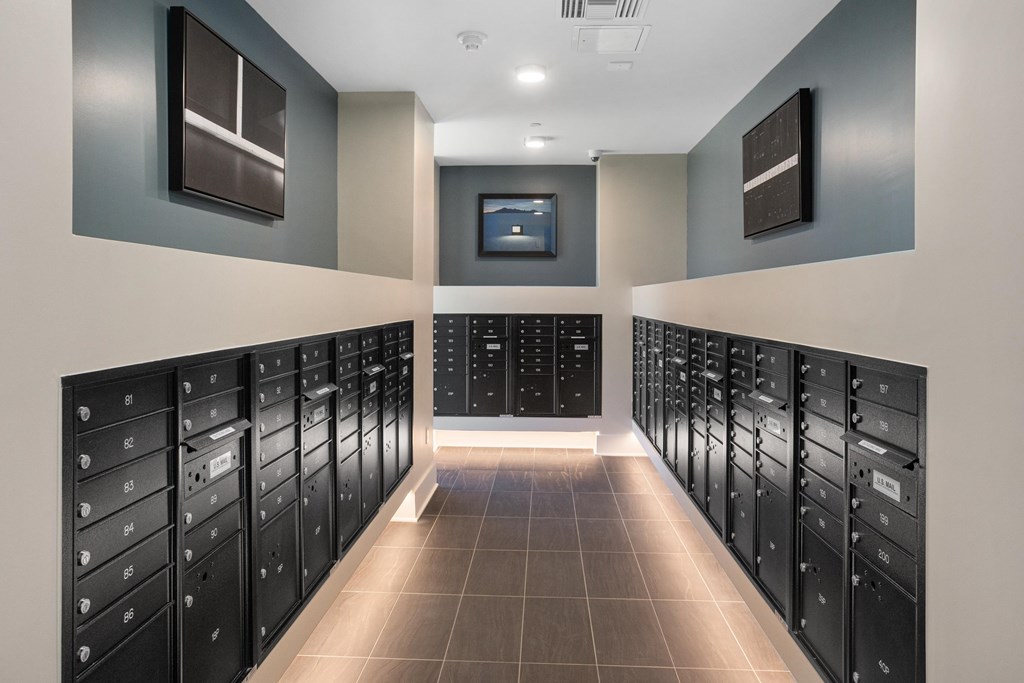 A long hallway with a row of lockers on each side.