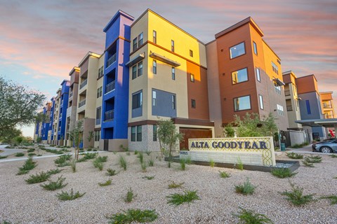 A building with the name "ALTA GOODYEAR" on a sign in front of it.