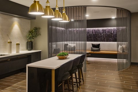 A dining area with a table and chairs.