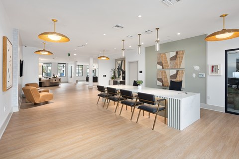 A modern office space with wooden floors and furniture.