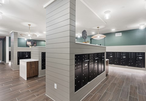 A modern kitchen with black cabinets and a wooden island.
