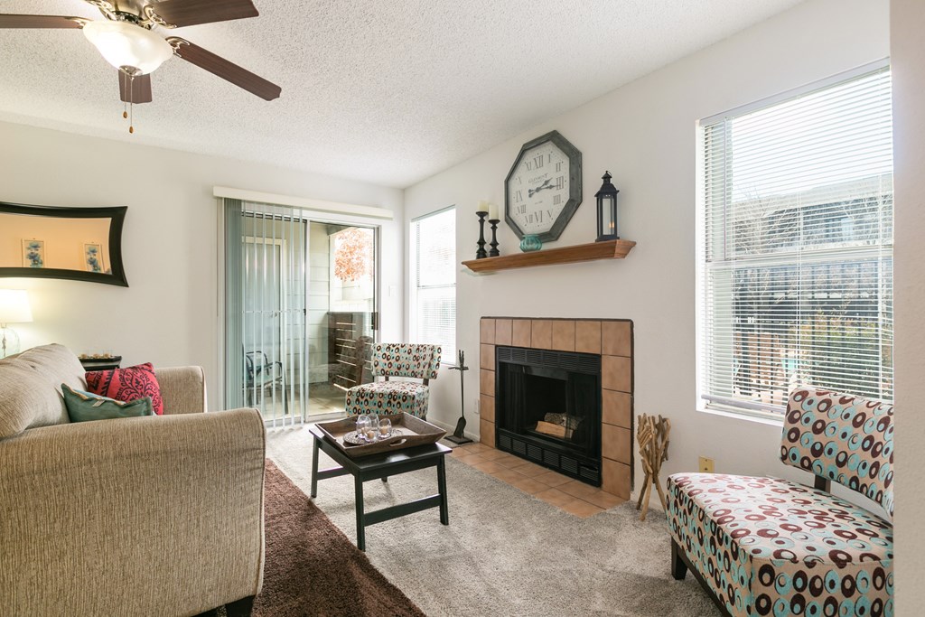 A living room with a fireplace and a couch.