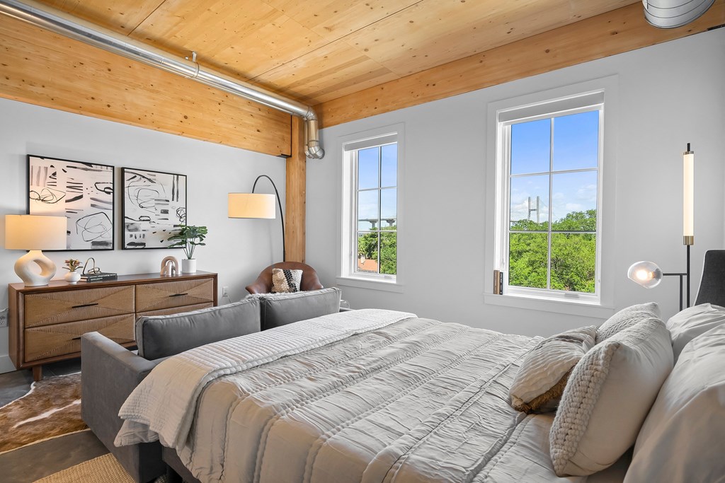 a bedroom with a bed and a dresser