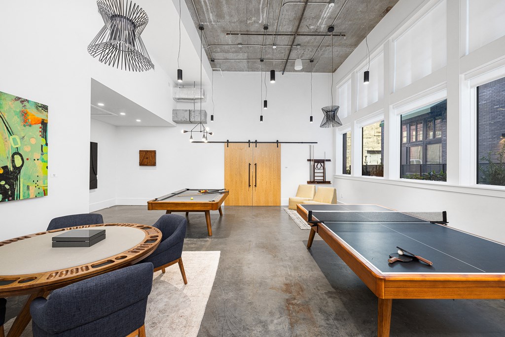 a conference room with two tables and a ping pong table