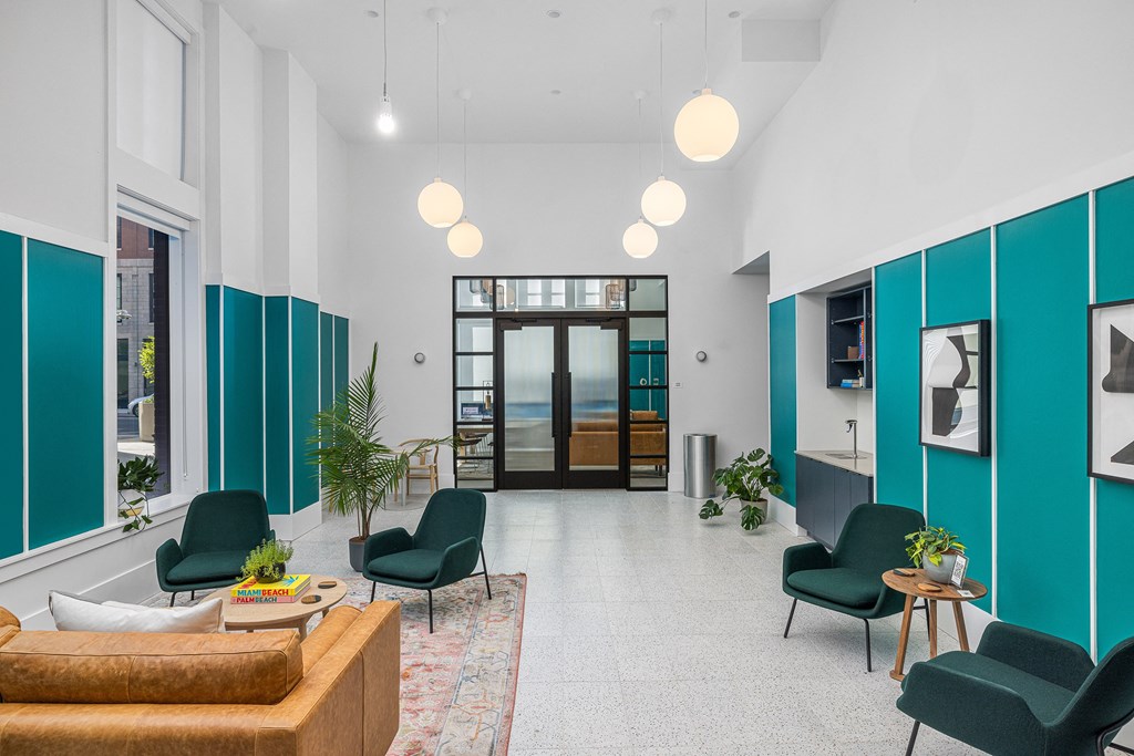 a living room with blue and white walls and a large glass door