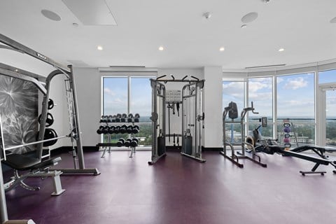 a gym with a view of the city