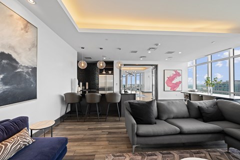 a living room with a couch and a table with chairs