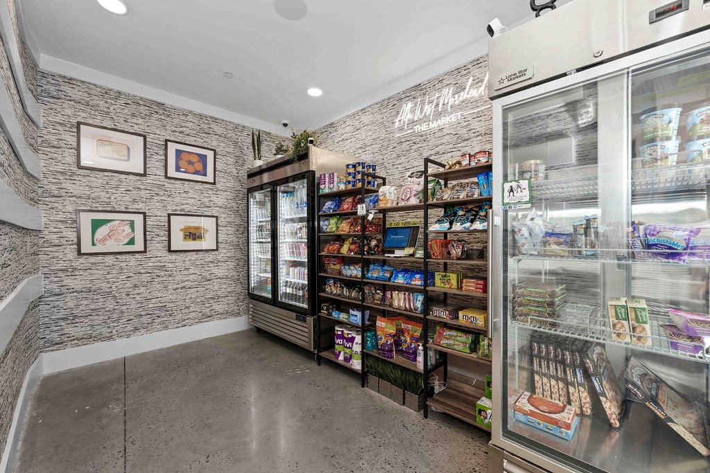 A wall of ice cream cases in a shop.