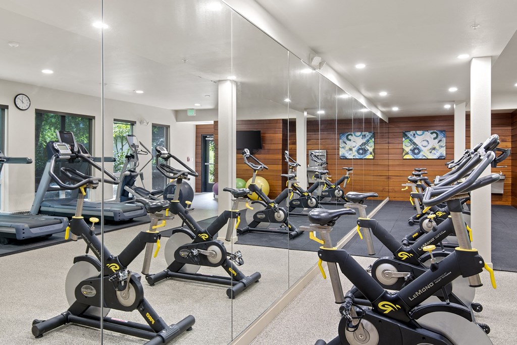 a gym with a lot of exercise equipment at Allez, Redmond, WA