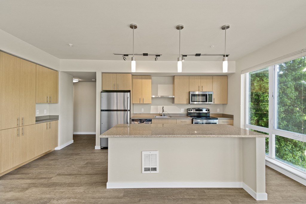 a kitchen with a large island with granite countertops at Allez, Washington, 98052