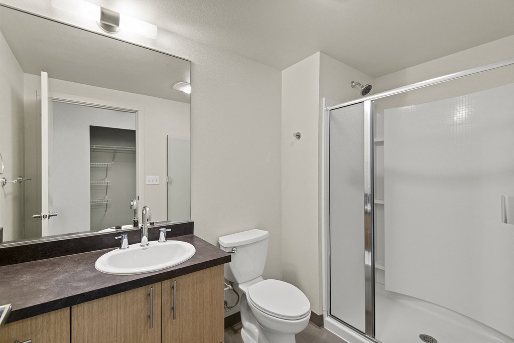 a bathroom with a toilet sink and shower at Allez, Redmond, Washington