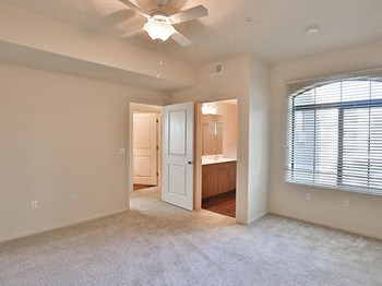 Unfurnished carpeted living room with ceiling fan - Photo Gallery 5