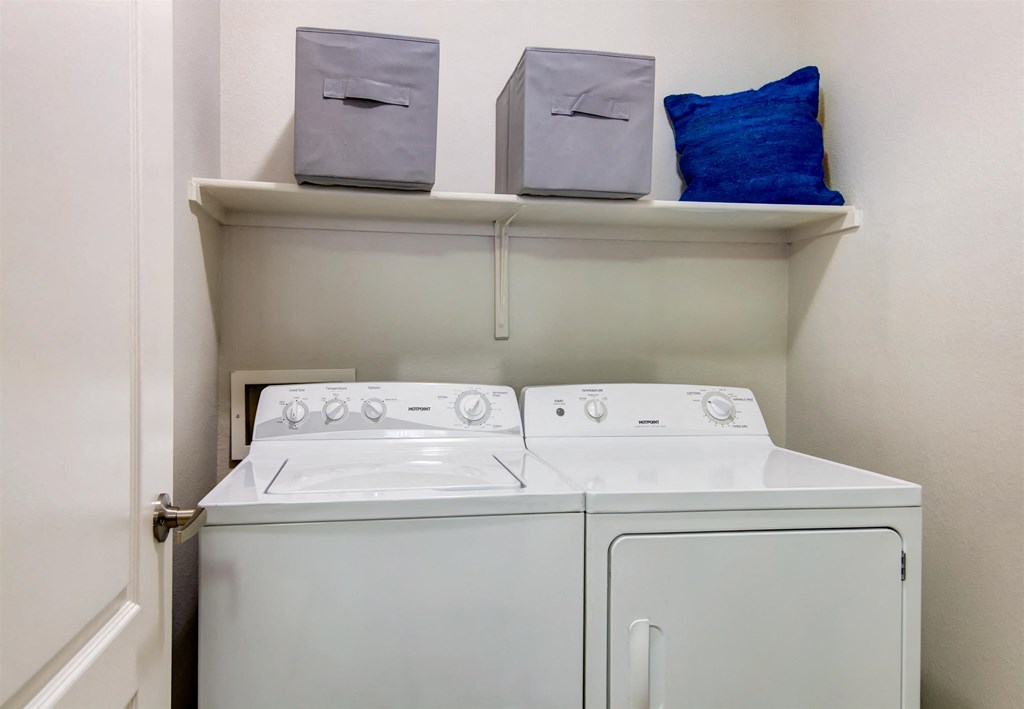 a small laundry room with a washer and dryer