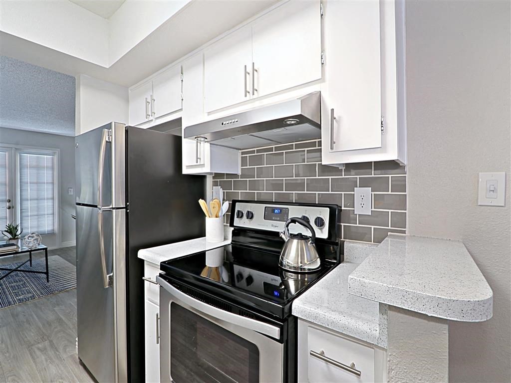 Electric Range In Kitchen at Villatree Apartments, Tempe, Arizona