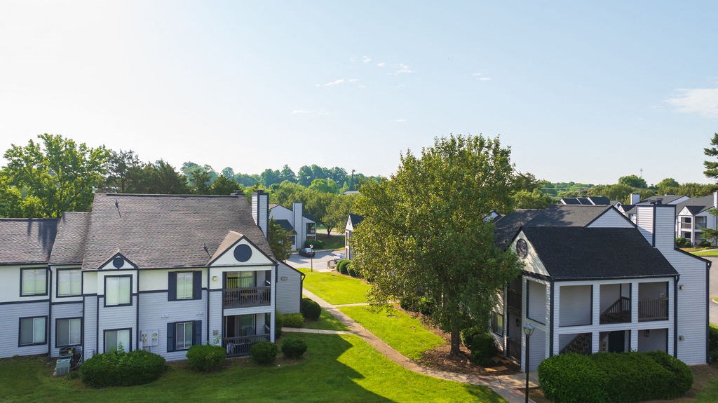 an aerial view of a neighborhood with houses and trees